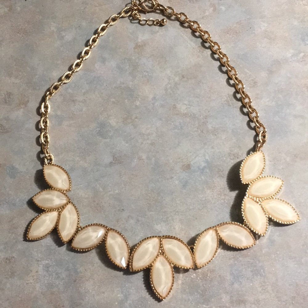 White stone and gold necklace